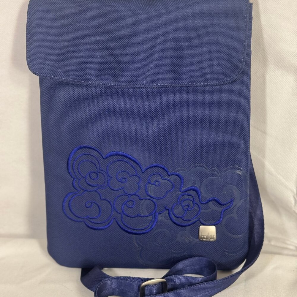 Haiku cross body tablet bag with distinct cloud pattern